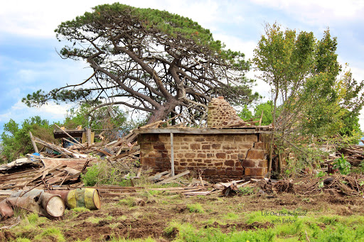 Old Lincoln Farm demolished with bricks and wood on floor